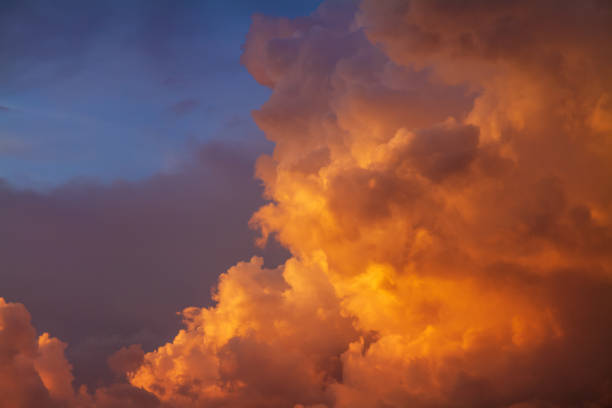 istock Dramatic bright orange yellow and blue colors of sunset sky 1341915723