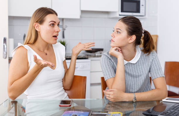 istock Two girls having emotional conversation 1341917975