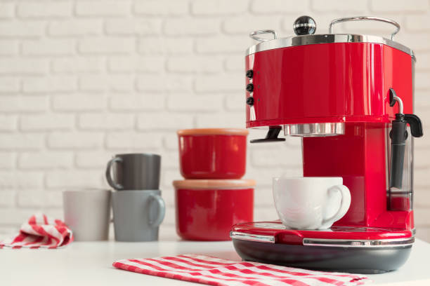 istock Modern kitchen. Red retro style coffee machine close up 1341920814