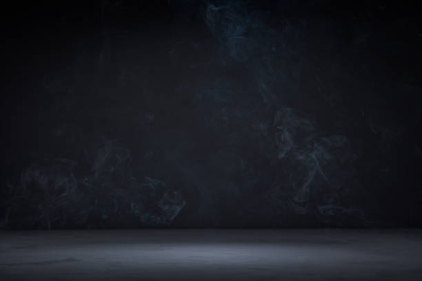 istock Dark background with concrete floor and smoke on it 1341920864