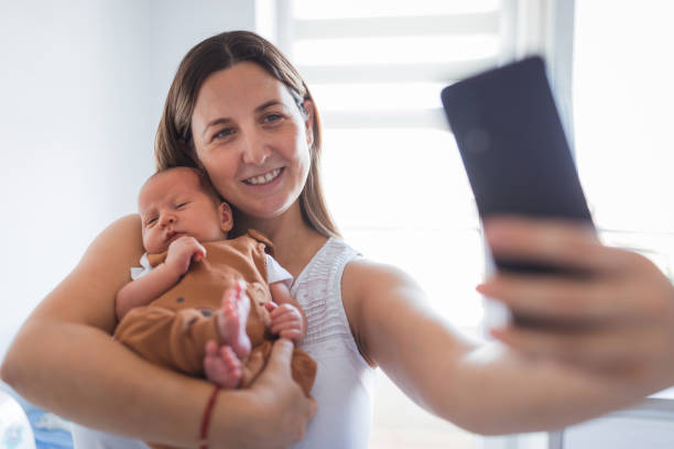 istock Mother taking selfie with her baby 1341920898