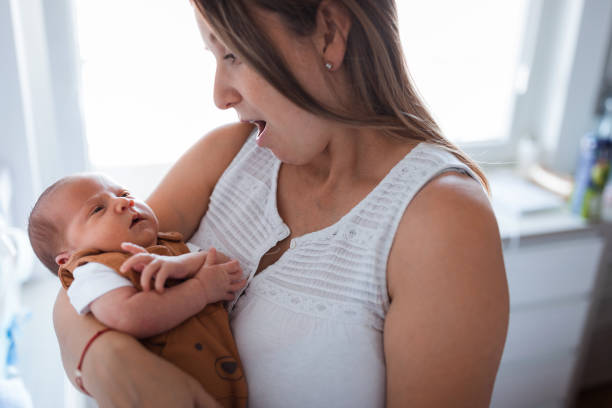 istock Woman singing lullaby to an infant boy 1341920925