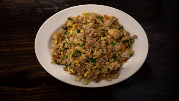 istock Closeup eating a popular Taiwanese fried rice with pork, egg and vegetables 1341922487