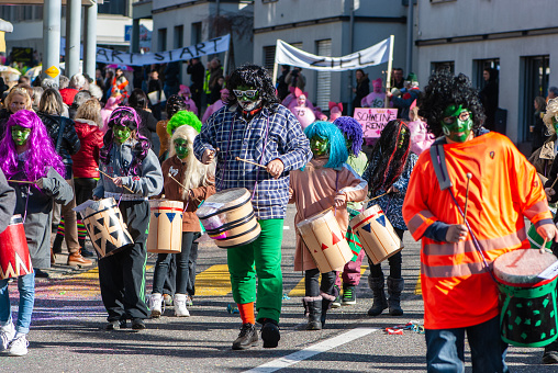 Colourful carnival in February in winter 2020. All people wore costumes. The weather was nice, the sun shined