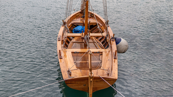 One brown wooden small sailing boats in Tivat stock photo