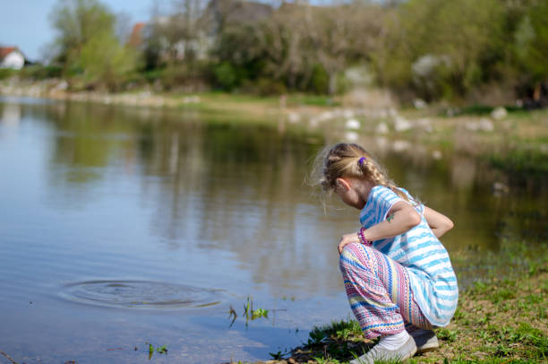 adorable cute child relaxing by the water