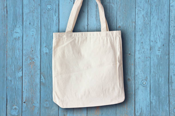 istock white fabric bag hanging on the blue wall mocap 1341925948