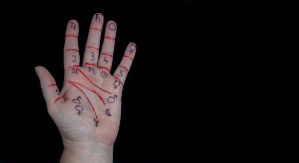istock Left hand palm with drawn symbols of the Cabala. 1341925986