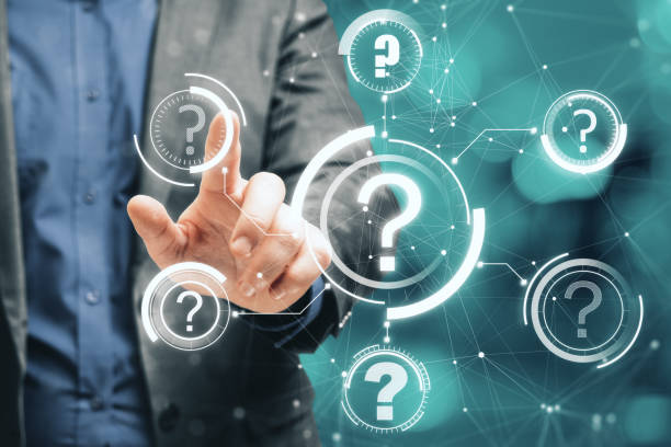 istock Close up of male hand pointing at abstract glowing question marks interface on blurry bokeh background. Technology, faq, online help, problem solution concept. Double exposure. 1341928954