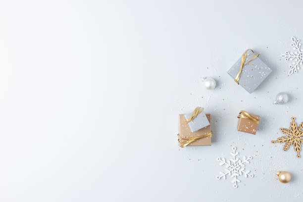 istock Christmas decorations with packaging gifts and balls on grey background. Flat lay, copy space 1341930529