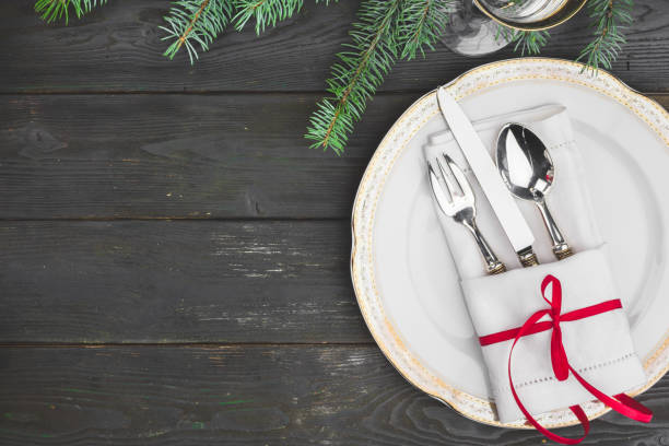 istock Black wooden table with stylish Christmas table setting 1341933956