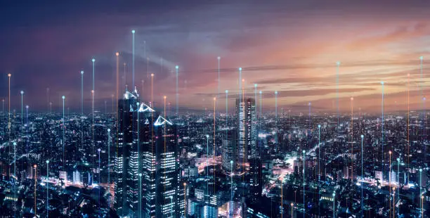 Photo of Telecommunication connections above smart city. Futuristic cityscape concept for internet of things (IoT), fintech, blockchain, 5G LTE network, wifi hotspot access, cyber security, digital technology
