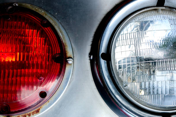 istock Close up of two old car headlights 1341936974