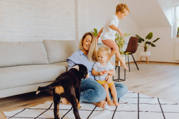istock Little boys playing with mom and dog 1341942670