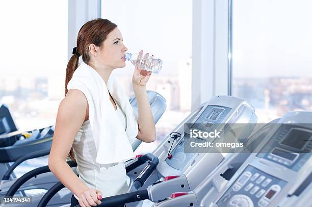 Young Woman At The Gym Exercising Drink Stock Photo - Download Image Now - Activity, Adult, Athlete