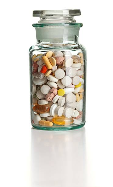 istock Full chemistry bottle with colorful pills 134194642