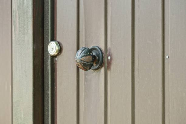 istock one round black iron door handle on brown metal 1341955642