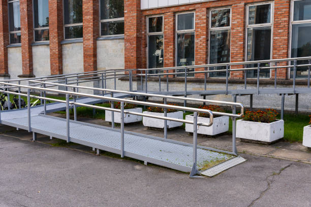 Metal ramp at the entrance to a public building for the disabled stock photo