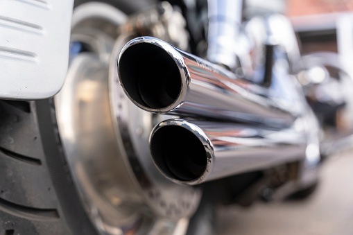 chrome-plated motorcycle exhaust pipes, motorcycle rear.
