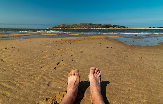 Seating on Conwy Morfa Beach in Wales in beatiful weather.