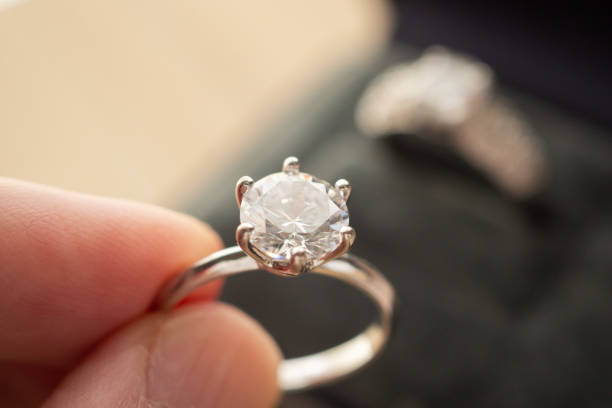 istock hand hold beautiful jewelry diamond ring 1341962167