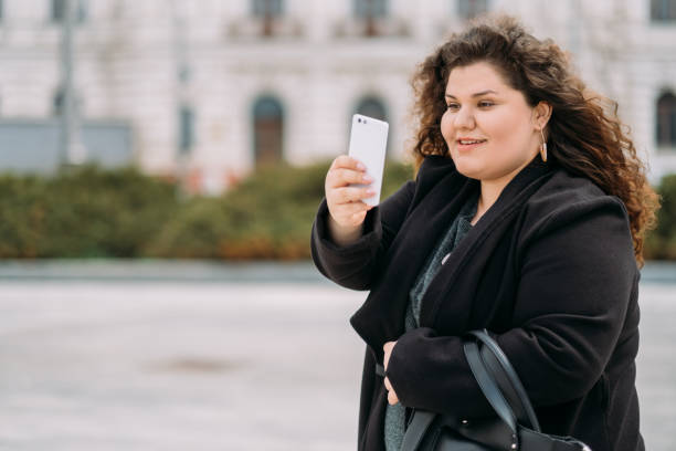 istock enjoying walk happy plus size woman catch moment 1341962193