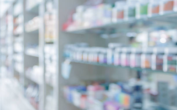 farmacia farmacia estantes de farmacia interior borroso fondo abstracto - farmacia fotografías e imágenes de stock