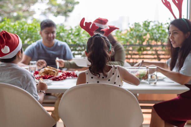 istock Family celebrating Christmas on patio 1341963419