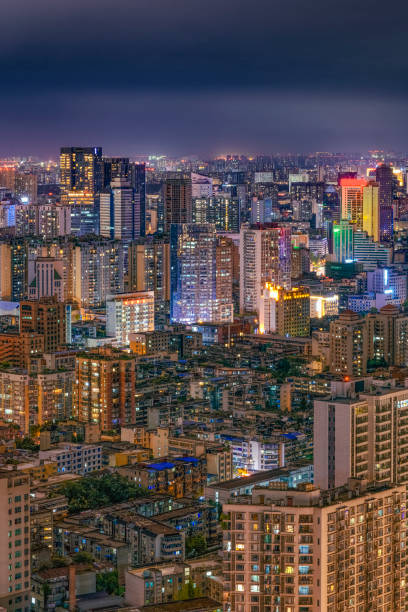 istock Urban modern high buildings and roads with dense nights 1341964594