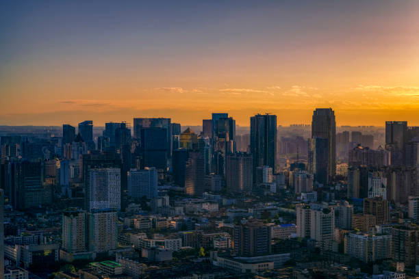 istock Modern urban architecture with dense cloud burning at dusk 1341964785
