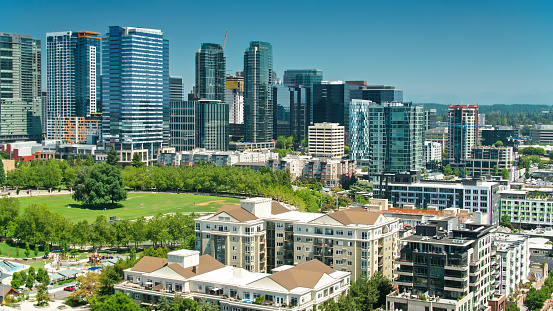 Aerial shot of Bellevue, Washington on a sunny day in summer, looking towards the modern office towers and Downtown Park.