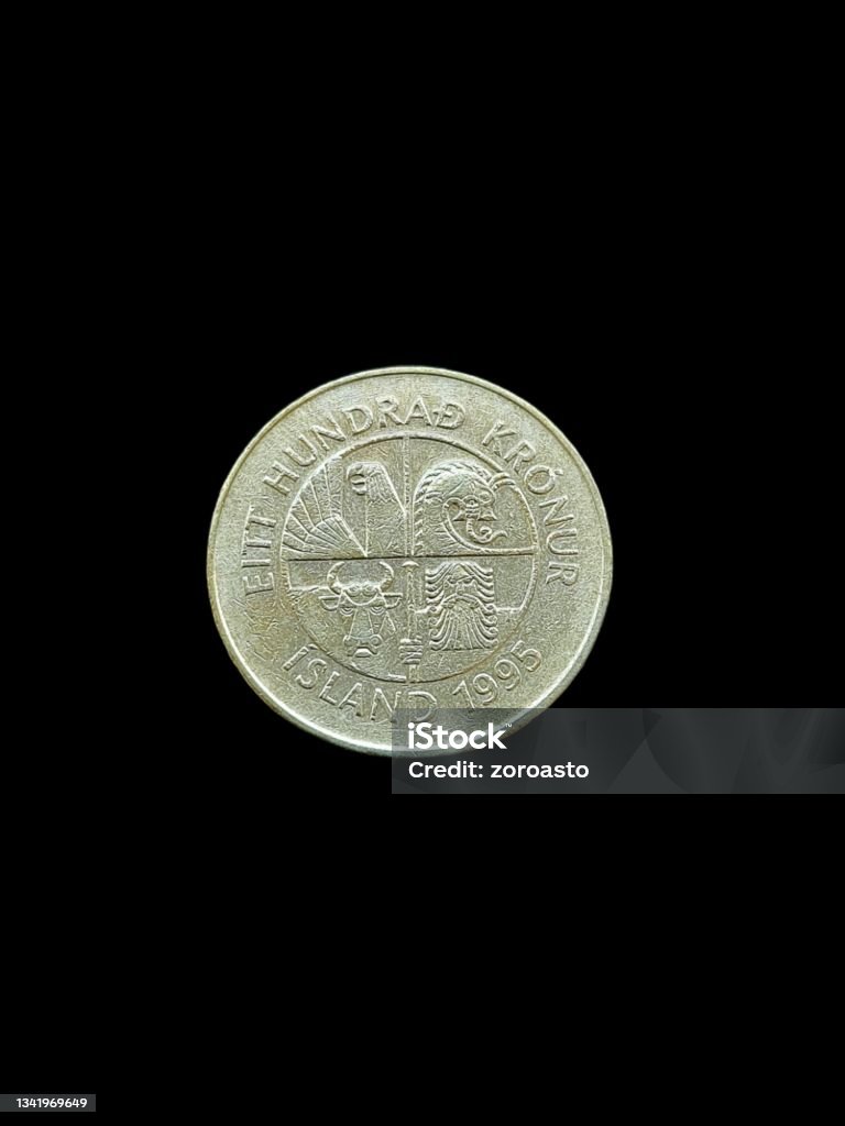 100 icelandic krona coin isolated 100 icelandic krona coin isolated on black background. Banking Stock Photo