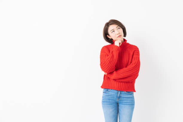 istock attractive asian woman who thinks 1341973835