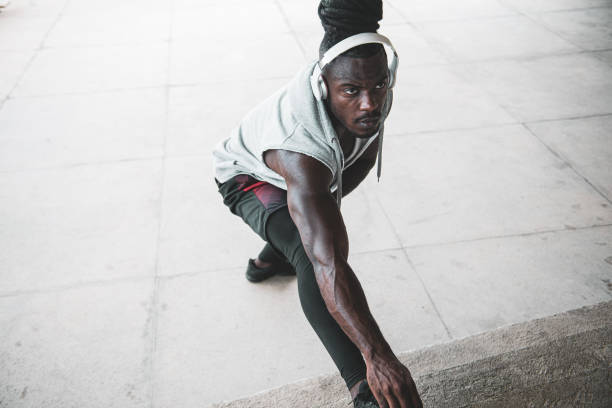 istock Shirtless afro runner with headphones 1341976488