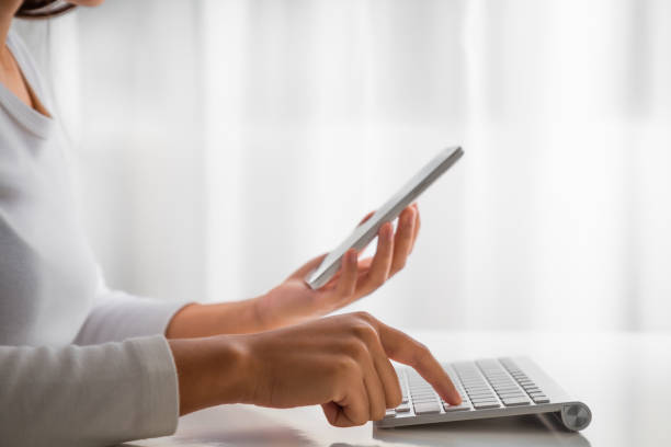 Woman hand enter a one time password for the validation process on laptop, Mobile OTP secure Verification Method, 2-Step authentication web page, Concept cyber security safe data protection business.