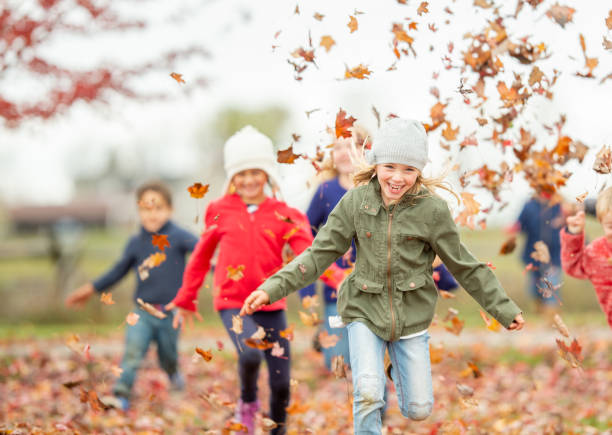 istock Multi-Ethnic Children Running in the Leaves 1341980073