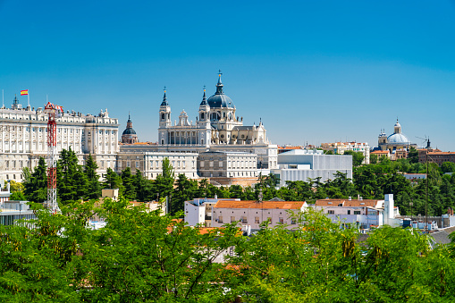 The Almudena Cathedral and the city of Madrid, Spain on a sunny day.