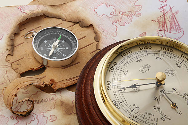 North Europe Compass and barometer on old chart of North Europe metcast stock pictures, royalty-free photos & images