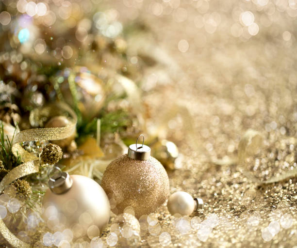 istock Christmas Gold Baubles Background 1341987970