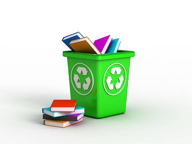 Books on recycle bin stock photo