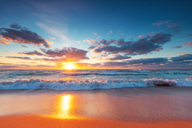 istock Beautiful cloudscape over the sea and beach, sunrise shot 1341994600