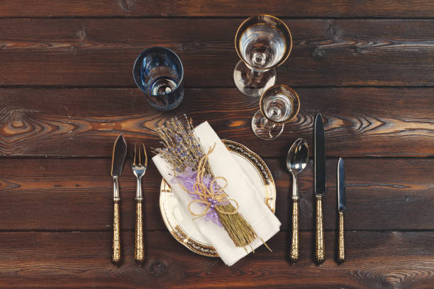 istock Holiday table setting on wooden table in lilac colors 1341994846