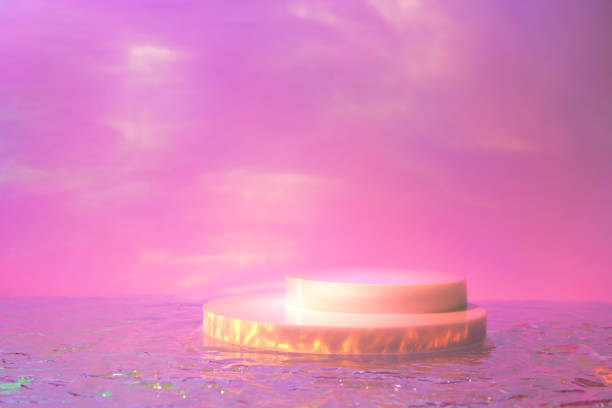 istock empty scene with cylinder podiums on holographic pink background 1341996455