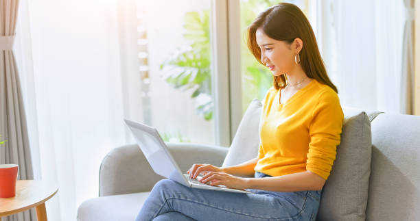 istock woman using laptop at home 1341997781