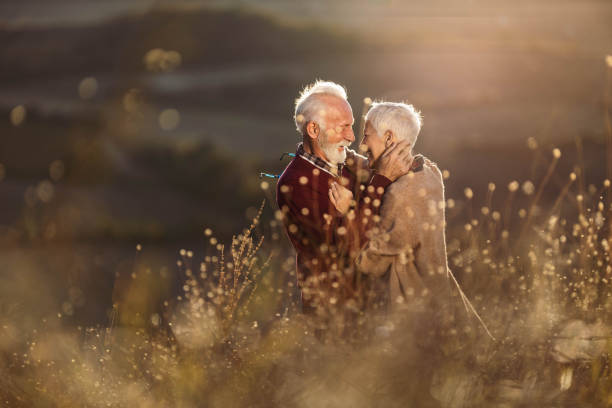 istock Affectionate senior couple talking to each other in autumn day. 1342002379