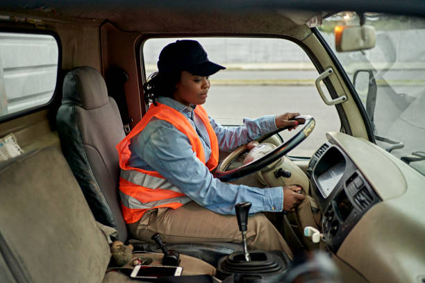 istock Mid 20s Female Truck Driver Turning Key in Ignition 1342002642