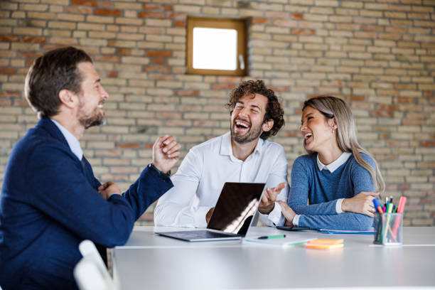 istock Cheerful couple communicating with insurance agent on a meeting. 1342003452