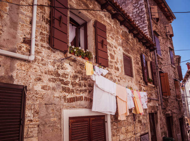 istock Old alley with laundry in Rovinj Croatia 1342008847