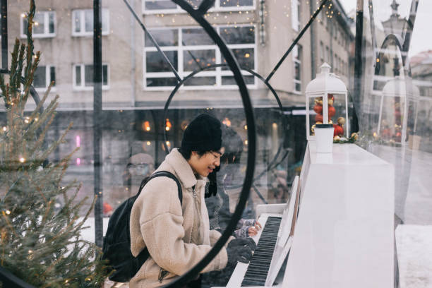istock Couple playing piano together 1342010565