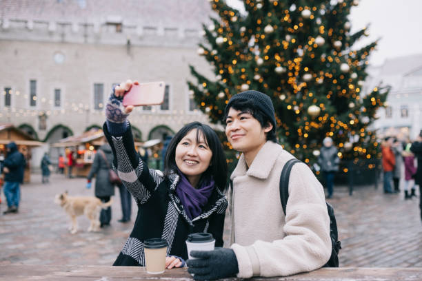 istock Couple taking selfies at Christmas Market 1342010569